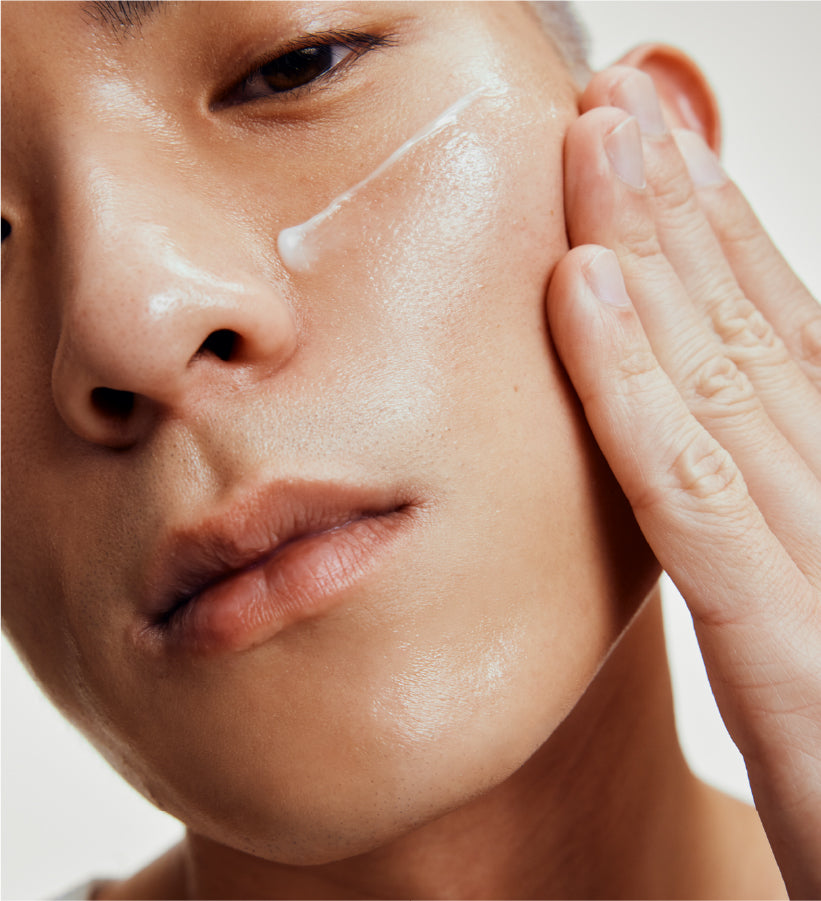 Person applying lightweight gel moisturizer to clean facial skin