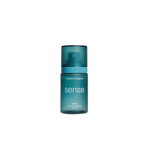Blue bottle labeled 'sense' on a dark gray background