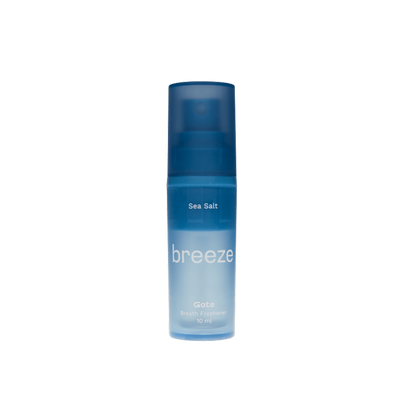 Blue bottle labeled 'breeze' on a white background